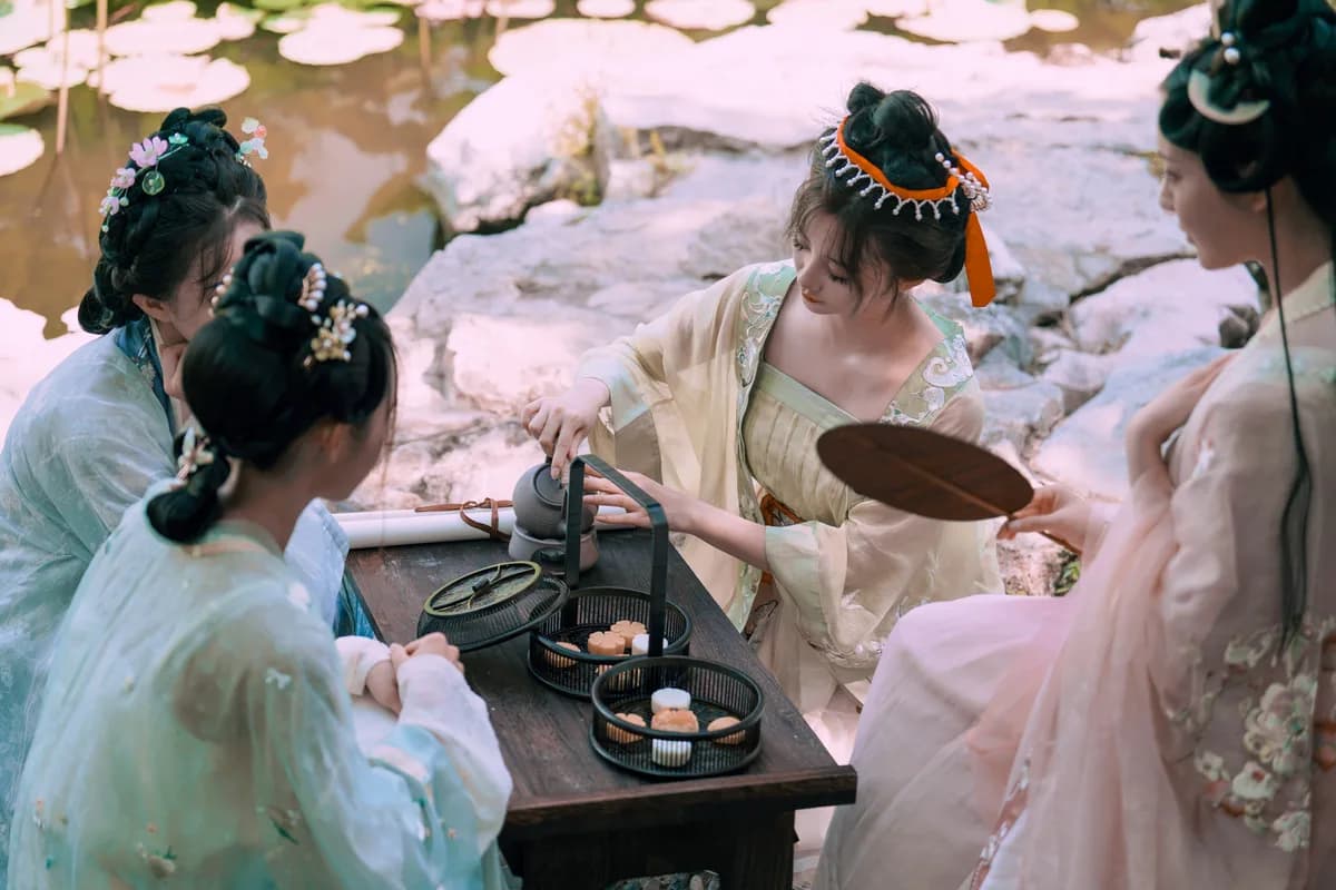 Spring tea ceremony by lotus pond — April 2026 Chinese horoscope