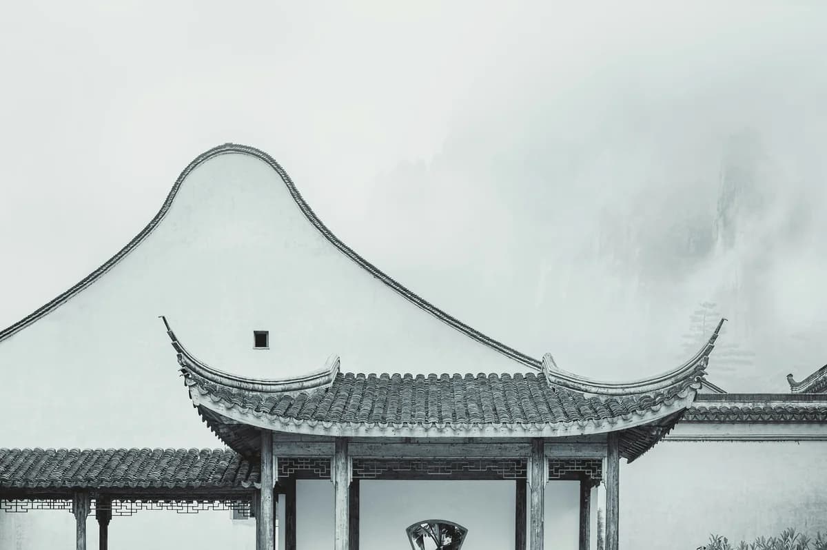Traditional Chinese architecture in misty mountains