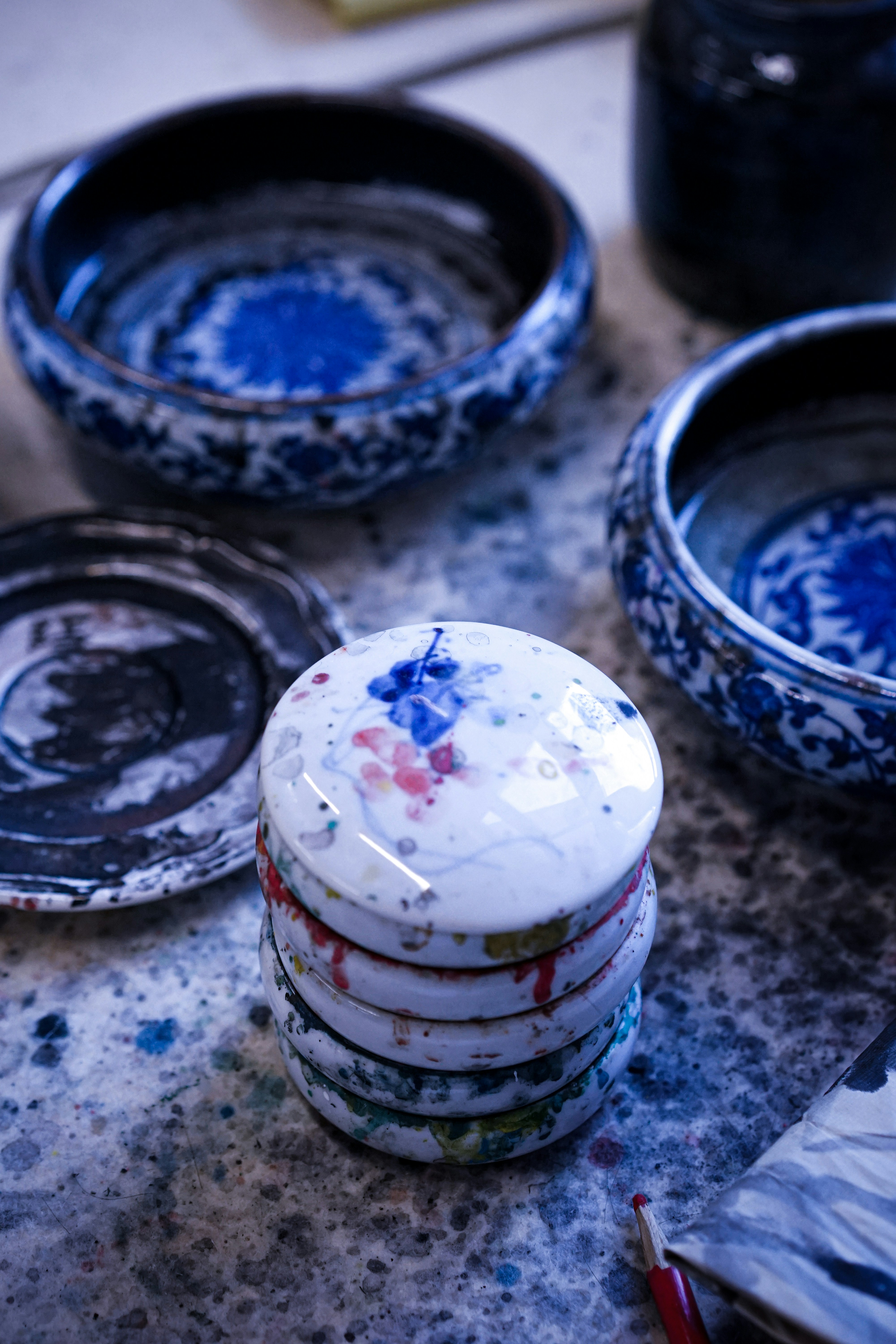 Artistic close-up of beautifully crafted blue and white ceramic bowls, representing Chinese culture and craftsmanship.