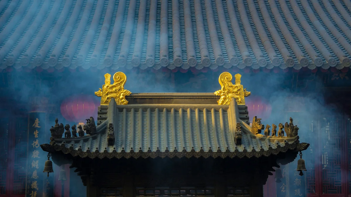 Traditional Chinese temple roof with golden dragons, symbolizing prosperity and fire energy for 2026 Year of the Fire Horse